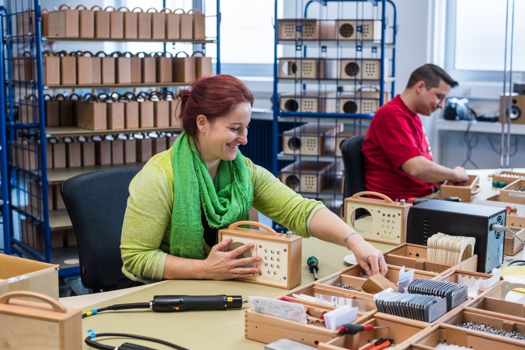 Two Winzki employees produce hörbert by hand